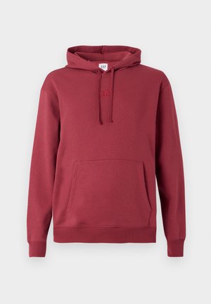 Punane kapuutsiga särk, millel on ees känguru tasku, stringiga kapuuts, soonikuga varrukad ja hem ning õrn tikand rinnal.