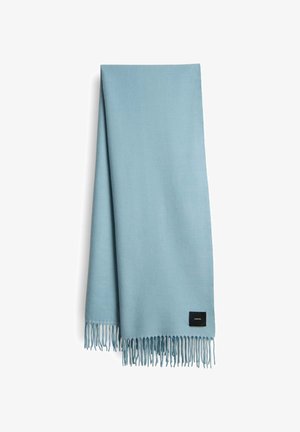 Light blue scarf made of soft material, featuring fringed edges and a small black label at one corner. Rectangular shape, smooth texture.