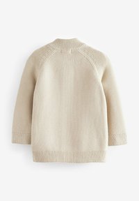 Beige stickad tröja med rund hals, raglanärmar och ribbad mudd och fåll. Texturerad tyg med ett enhetligt sy-mönster.