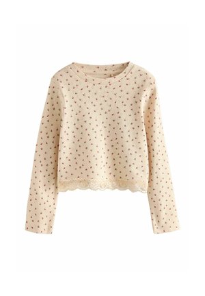 Cremfarbener Pullover mit langen Ärmeln, kleinem rosa Blumenmuster und Spitzenbesatz. Hergestellt aus weichem Strickstoff, mit Rundhalsausschnitt und taillierten Ärmeln.