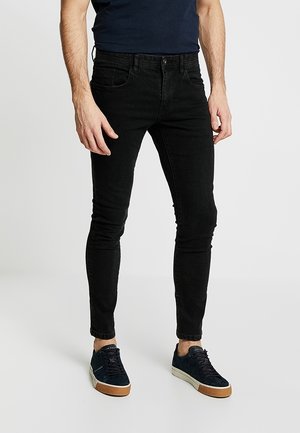 Vaqueros pitillo - rinsed denim