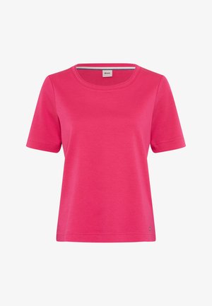 Bright pink short-sleeve T-shirt with round neckline and small metal logo tag near the hem, on a white background.