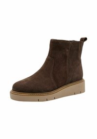 Bottine en suède marron avec des panneaux élastiques sur les côtés, bout rond et semelle plateformée beige texturée. Comprend une petite languette à l'arrière.