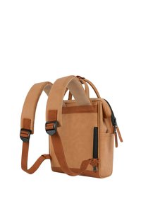 Tan leather backpack with padded shoulder straps, zippered compartments, and side pocket. Features a minimalistic design and stitching details.