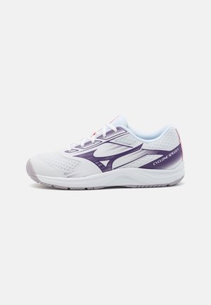 White athletic shoe with purple accents, mesh upper, rubber sole, and reinforced heel. Features breathable material and lacing design.