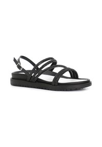 Sandalias negras con múltiples correas brillantes, suela de goma plana, correa ajustable en el tobillo y plantilla acolchada para mayor comodidad.