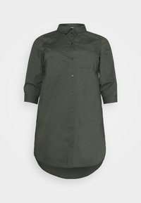 Dark green, long-sleeve, button-up shirt with a collar, single chest pocket, curved hem, and smooth texture.