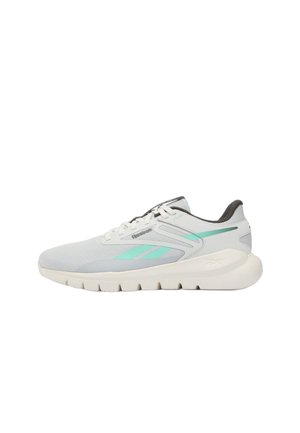 Witte en grijze Reebok hardloopschoen met turqoise logodetails, dikke zool en vetersluiting, zijaanzicht gericht naar links.