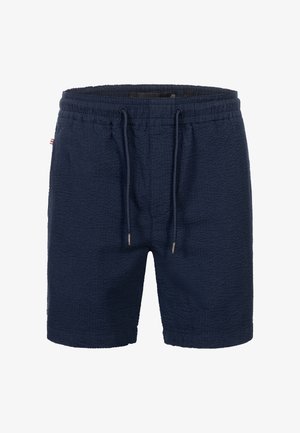 Costume da bagno blu navy in tessuto, con vita elastica e coulisse, caratterizzati da piccole punte metalliche alle estremità della coulisse.