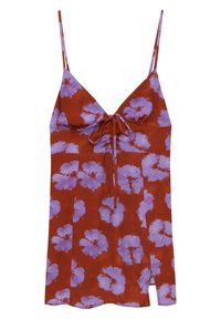 Robe à bretelles spaghetti de couleur rouille, présentant un motif floral en violet clair, avec des nœuds au niveau de la poitrine et une fente latérale.