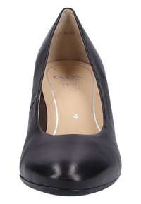 Black leather high-heeled shoe with a pointed toe, soft interior lining, and a smooth texture. Features a cushioned insole with branding.