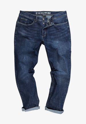 Jeans de mezclilla azul oscuro con dobladillos enrollados, cierre de botón y etiqueta "JP Solo para Hombres Reales" en la cinturilla.