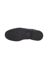 Suola di scarpa in gomma nera con superficie testurizzata, dettaglio del logo circolare e un modello di battistrada resistente per una migliore aderenza.
