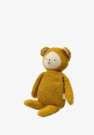 Weicher, senfgelber Teddybär mit strukturiertem Körper, ovalem Gesicht, geschlossenen Augen und runden Ohren. Verfügt über ein Stoffetikett auf einer Seite.