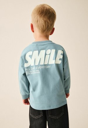 Next, REGULAR FIT - LONG SLEEVE BACK GRAPHIC T-SHIRT . - Long sleeved top - mineral blue smile all day everyday