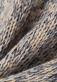 Knit fabric featuring a three-color weave of gray, beige, and navy, with a soft texture and visible braided patterns.