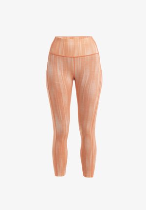 Leggings taille haute en orange clair avec un motif texturé en rayures. Tissu lisse avec un design ajusté et une coupe à la cheville.