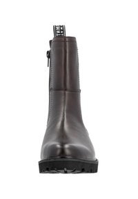 Brown leather ankle boot with a smooth finish, featuring a side zipper and a textured rubber sole for grip. Back pull tab for easy wear.
