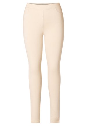 Lichtbeige leggings gemaakt van rekbare stof. Kenmerkt een gladde textuur, elastische tailleband en geen zichtbare naden of patronen.