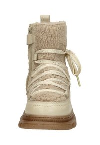 Beige laars met een getextureerd, fuzzy bovenwerk, een gladleren paneel en een rubberen zool. Inclusief veters en een zijrits.