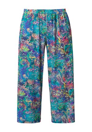 Volné kalhoty s výraznými vícebarevnými květinovými a abstraktními vzory na modrozeleném pozadí, viditelný elastický pás.
