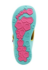 Suela de zapato que presenta goma turquesa y rosa con patrones de tread hexagonales y redondeados, proporcionando tracción. Superficie texturizada para agarre.
