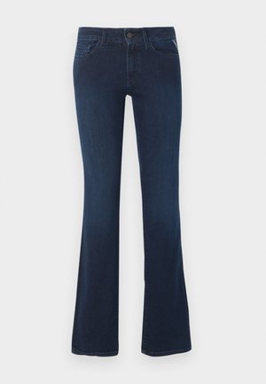 Tmavomodré džínsy z denimu so stredným pásom, zapínaním na predné gombíky a zips a mierne rozšírenými nohavicami.