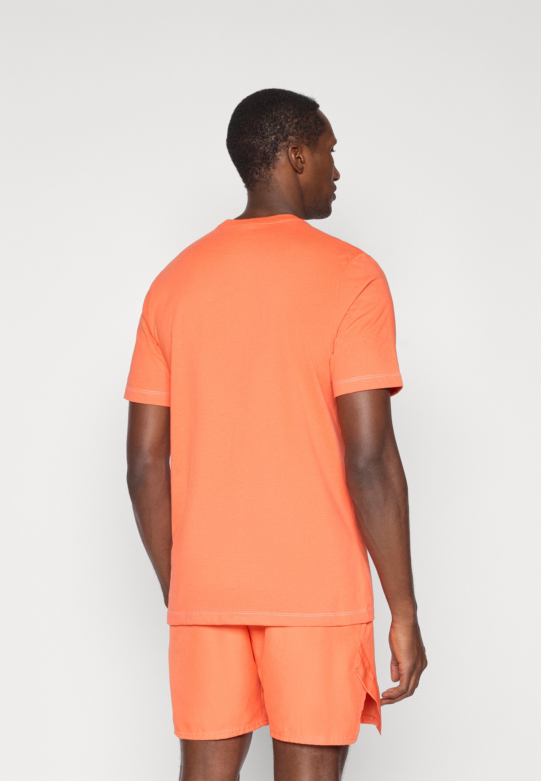 turf orange nike shorts