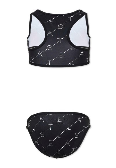 Maillot de bain deux pièces noir avec un motif à pois blancs formant des lettres diagonales sur les parties haute et basse.