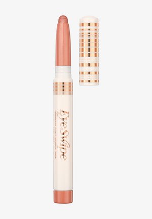 Rose gold and cream eye shadow crayon with a twist-up design. The top is rounded and highlighted with a shimmery finish. Cap features stripes.