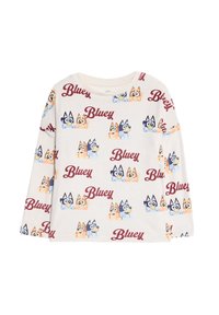 Camisa de manga larga blanca con un patrón repetido de perros de dibujos animados y la palabra "Bluey" en burdeos. Tejido suave, corte relajado.