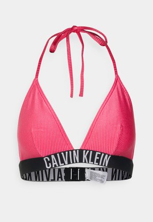 Pink ribbed bikini top with a triangular design, tied neck straps, and a black band featuring white "CALVIN KLEIN" branding.