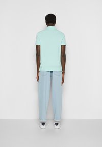 Tommy Hilfiger REGULAR - Polo - frosty jade