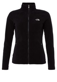 Mustapippu fleece-takki korkealla kauluksessa, edessä vetoketju ja kaksi sivutaskua. Takissa on pieni valkoinen logo vasemmalla ylhäällä.