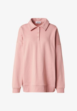 Roze pullover trui met een kraag, drie knopen en lange mouwen. Gemaakt van zacht materiaal met een losse pasvorm en geribbelde manchetten.