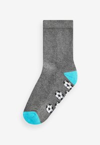 Grau Baumwollsocke mit einer hellblauen Zehe und Ferse, die entlang der Seite kleine Muster von weißen und schwarzen Fußballen aufweist.