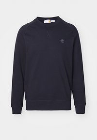 Sweat-shirt noir col rond à manches longues avec petit logo arbre Timberland sur le côté gauche de la poitrine.
