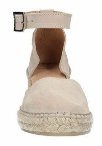 Beige suede espadrille with ankle strap, woven jute sole, rounded toe, and stitched detailing along the edge.