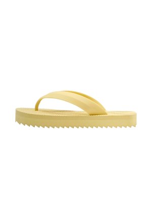 Gele rubberen slippers met een gestructureerd voetbed en een dikke zigzagzool, voorzien van een brede Y-vormige band voor grip op de tenen.