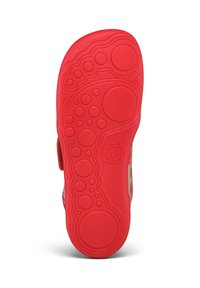 Red rubber sole with textured pattern featuring circles and waves; reinforced with a smooth finish. Suitable for casual footwear.