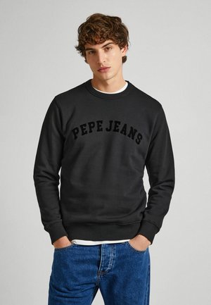 Czarny sweatshirt z okrągłym dekoltem, wykonany z bawełny, z tekstem "PEPE JEANS" w wypukłych literach. Zawiera prążkowane mankiety i dół.