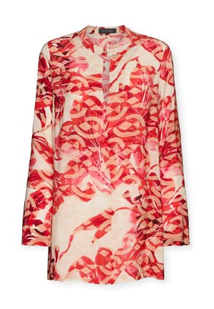 Tunique à manches longues avec un motif tourbillonnant abstrait rouge et pêche, col rond et fermeture par un bouton unique au niveau du cou.