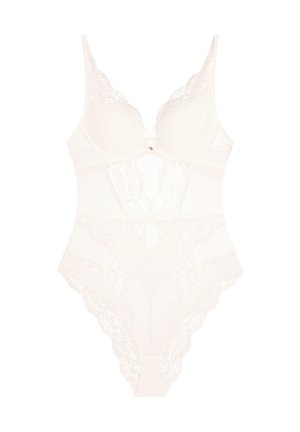 White lace bodysuit with sheer detailing, underwire cups, scalloped edges, and a small gold heart accent at the center front.