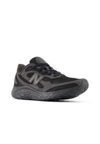Black and gray athletic shoe with mesh upper, padded collar, and textured sole. Features laces and logo on the side.