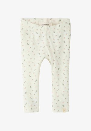 Leggings en coton côtelé de couleur vert clair, avec un motif floral composé de fleurs roses et de pois jaunes. Taille élastique, étiquette de marque sur le poignet.