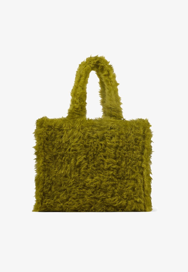 Olive green rectangular handbag covered in shaggy faux fur with two matching furry handles.