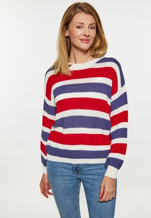 Gestreepte sweater in rood, wit en marineblauw met een losse pasvorm, ronde halslijn en geribde mouwen, gecombineerd met blauwe jeans.