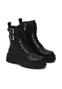 Black leather combat boots with side zippers, gold-tone hardware, round laces, and chunky soles. Features dual buckles at the ankle.