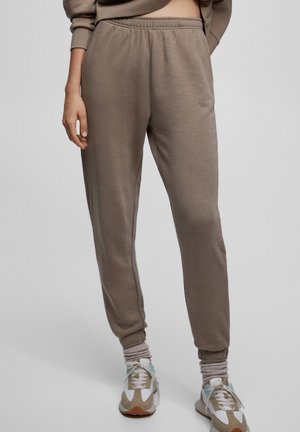 WITH ELASTIC TRIMS - Tracksuit bottoms - stone