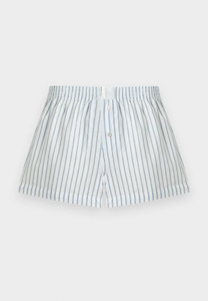 Boxers blancs à fines rayures verticales bleues et fermeture par boutons à l’avant, présentés sur un fond clair uni.